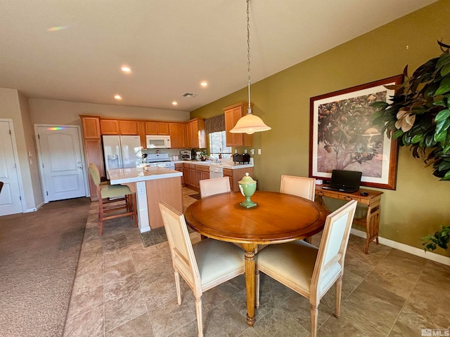 view of carpeted dining space