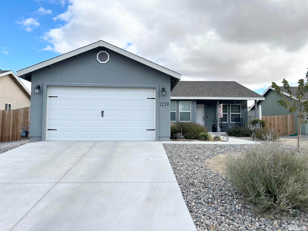 single story home featuring a garage