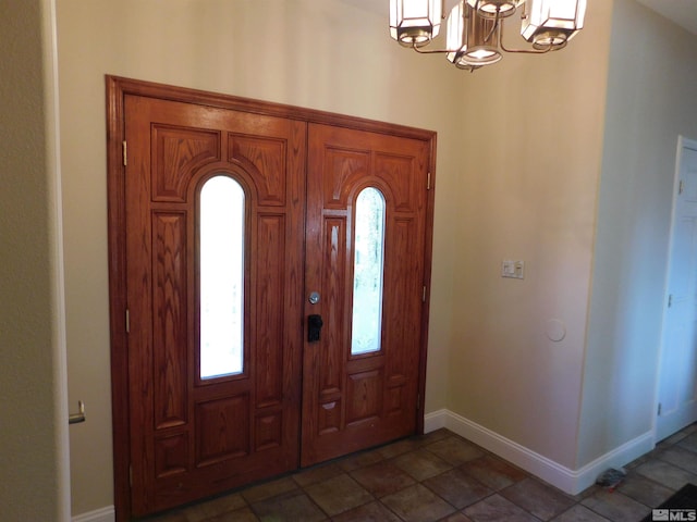 entryway featuring a notable chandelier