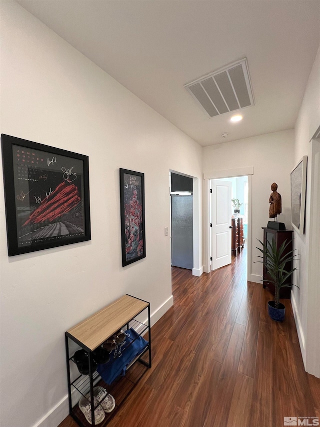 corridor featuring dark hardwood / wood-style flooring