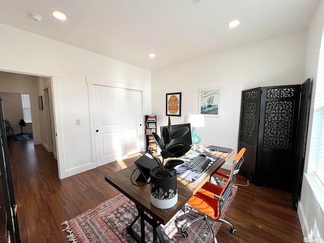 home office with dark wood-type flooring