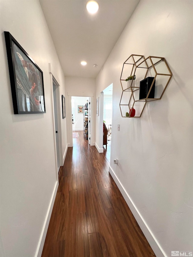 hallway featuring dark wood-type flooring