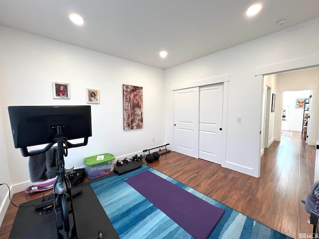 exercise area with dark hardwood / wood-style floors