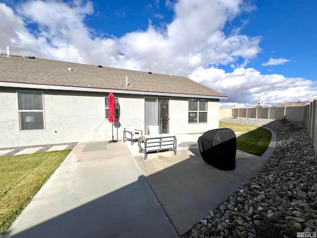 back of house featuring a yard and a patio