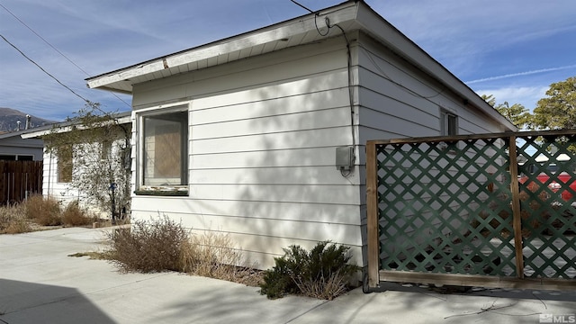 view of side of property with fence
