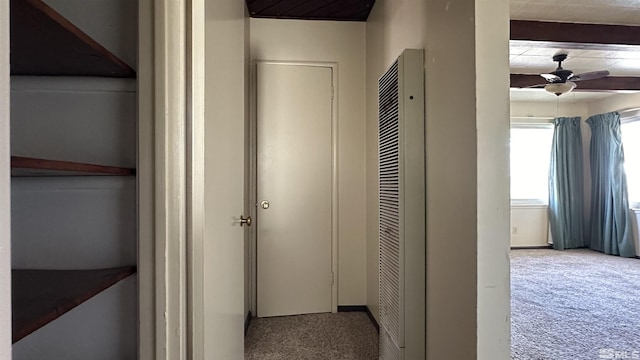corridor with a heating unit and carpet