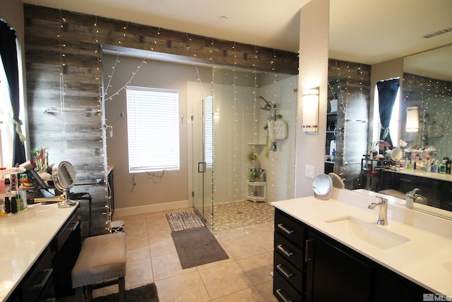 bathroom with vanity, a shower, and tile patterned flooring