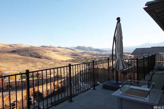 balcony featuring a mountain view