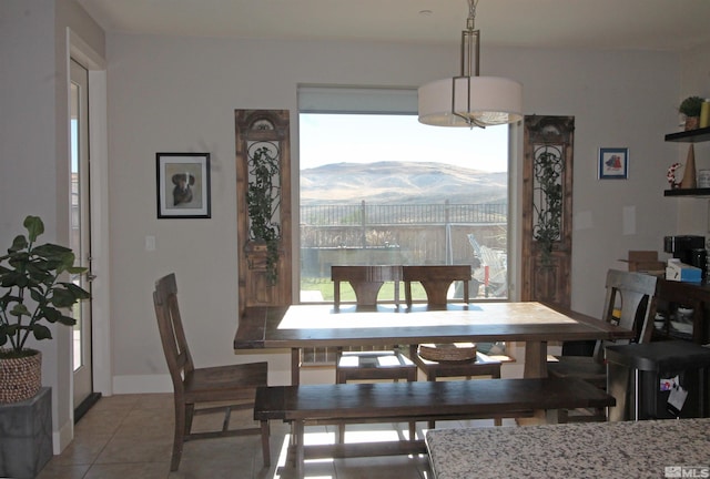 tiled dining space with a mountain view