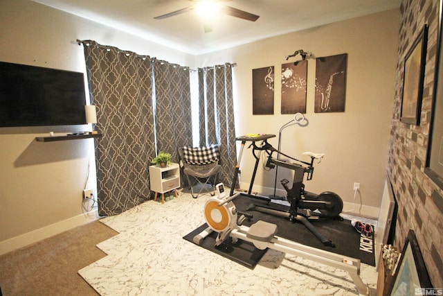 exercise area featuring carpet flooring and ceiling fan