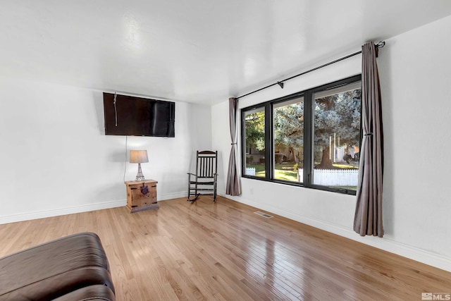 unfurnished room featuring light hardwood / wood-style floors