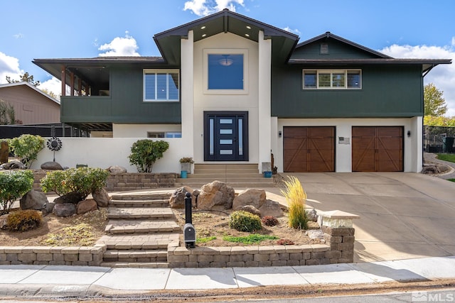 view of front of home featuring a balcony and a garage