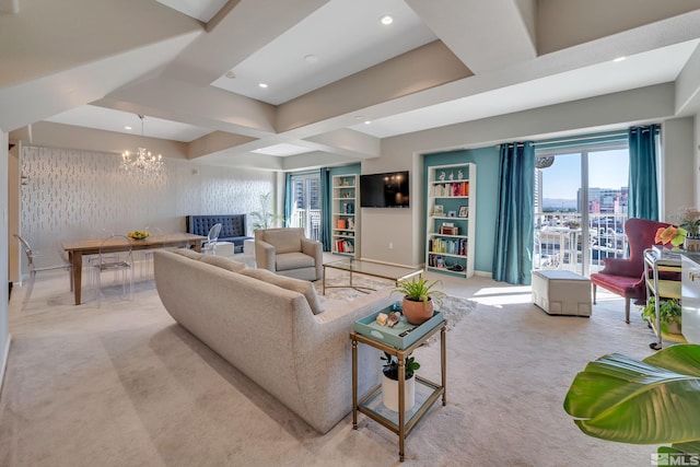 carpeted living room featuring a notable chandelier