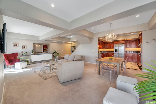 carpeted living room featuring a notable chandelier and sink