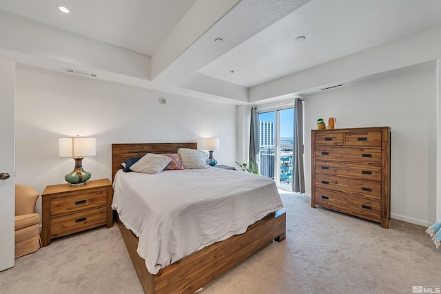 carpeted bedroom featuring access to outside