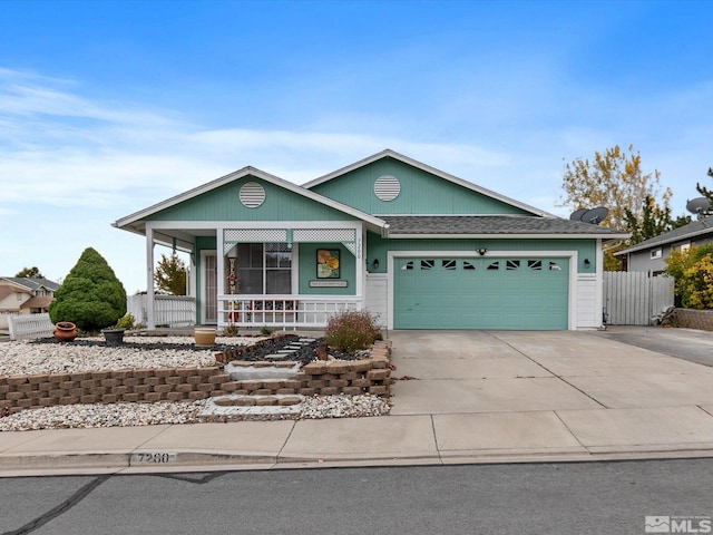 single story home with covered porch and a garage