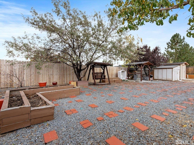 exterior space featuring a shed, a gazebo, and a patio