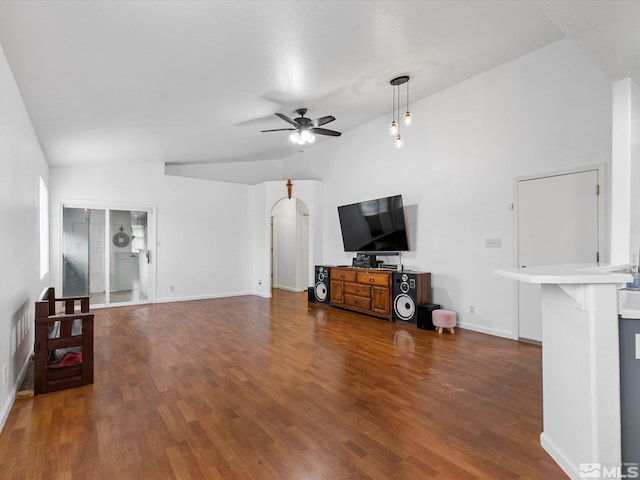 living room featuring dark wood-type flooring, ceiling fan, and lofted ceiling