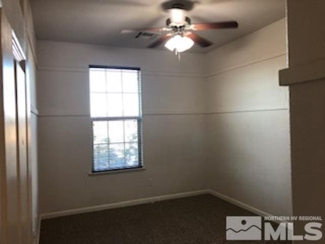 unfurnished room with ceiling fan