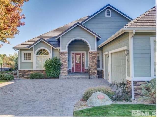 view of front of property with a garage