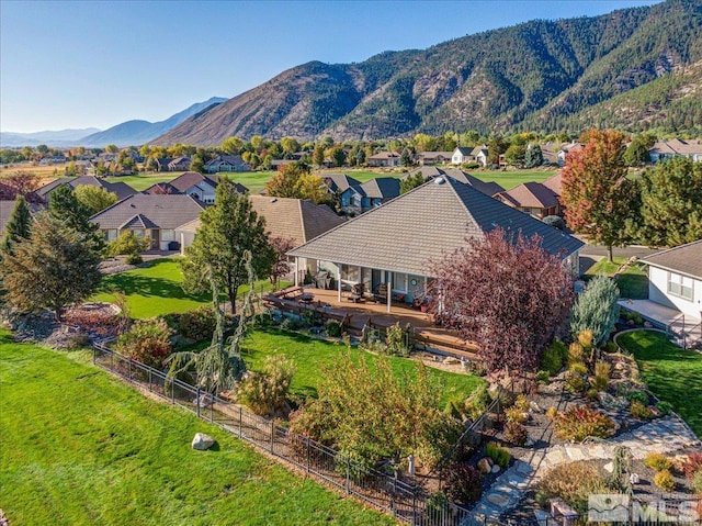 birds eye view of property with a mountain view