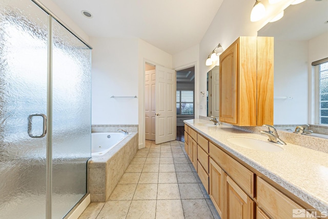 bathroom with vanity, tile patterned floors, and plus walk in shower