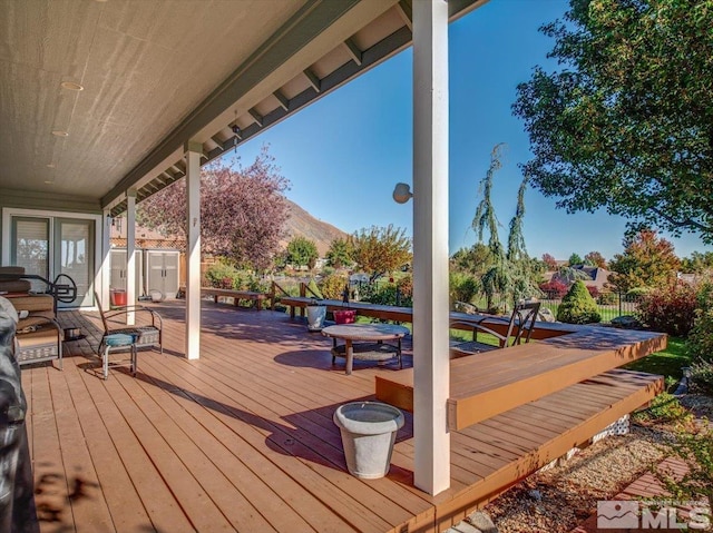 wooden terrace with a mountain view