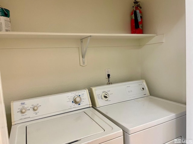 washroom featuring washer and dryer