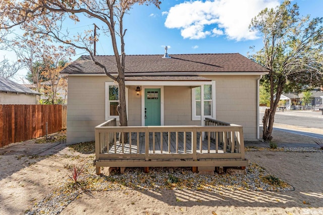 bungalow with a wooden deck