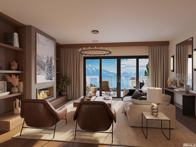 living room featuring light hardwood / wood-style flooring, a notable chandelier, and a water view