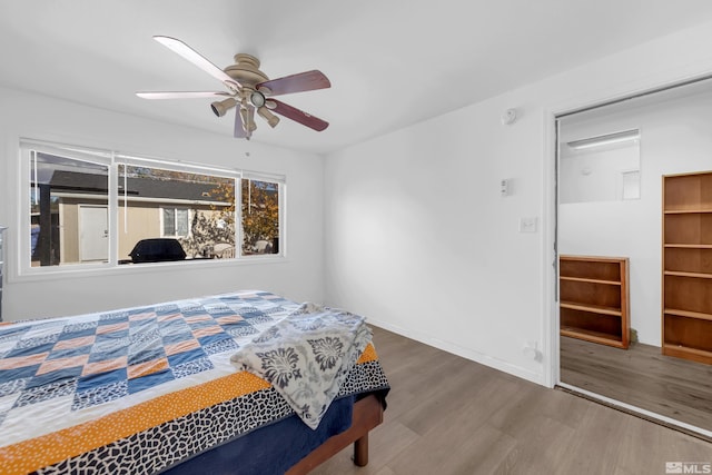 bedroom featuring wood-type flooring and ceiling fan