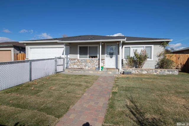 ranch-style house featuring a garage and a front lawn