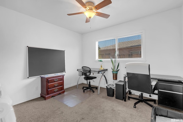 carpeted office with ceiling fan