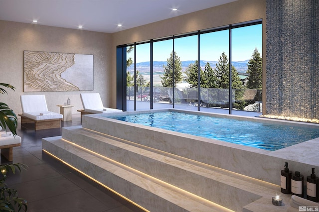 view of pool featuring a mountain view and a hot tub