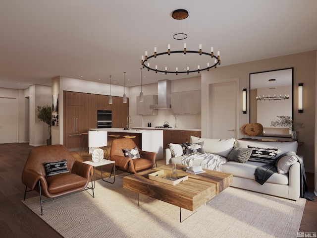 living room with dark wood-type flooring, a chandelier, and sink