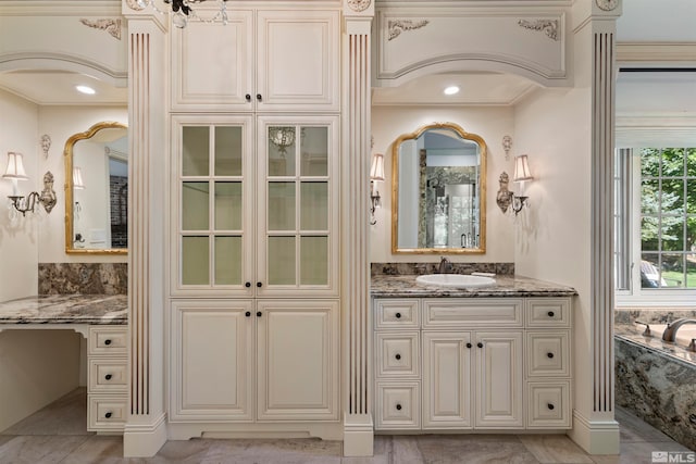 bathroom featuring vanity and crown molding