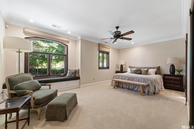 carpeted bedroom with ceiling fan, ornamental molding, and multiple windows