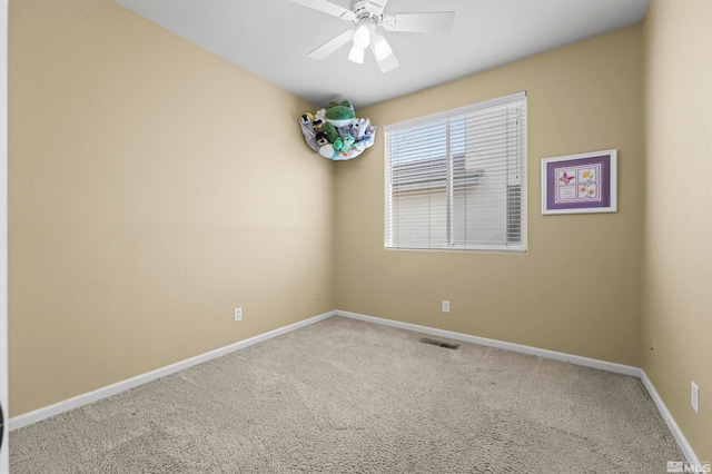 unfurnished room with carpet flooring and ceiling fan