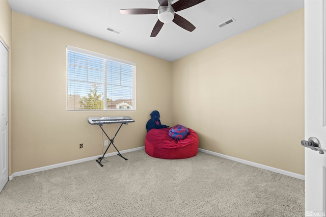 miscellaneous room with light carpet and ceiling fan