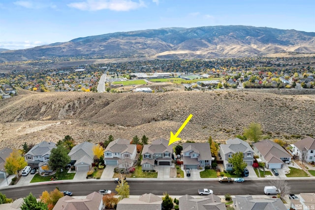 birds eye view of property featuring a mountain view