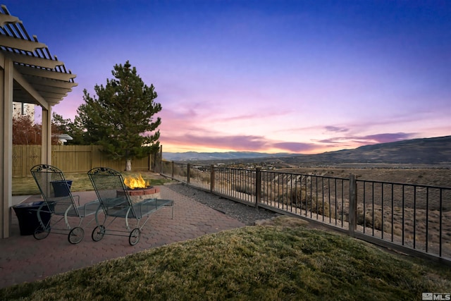 patio terrace at dusk with a mountain view