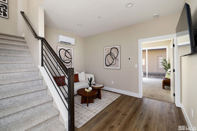 interior space featuring a wall unit AC and dark hardwood / wood-style flooring