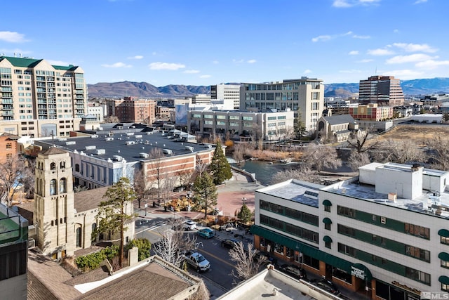 property's view of city with a mountain view