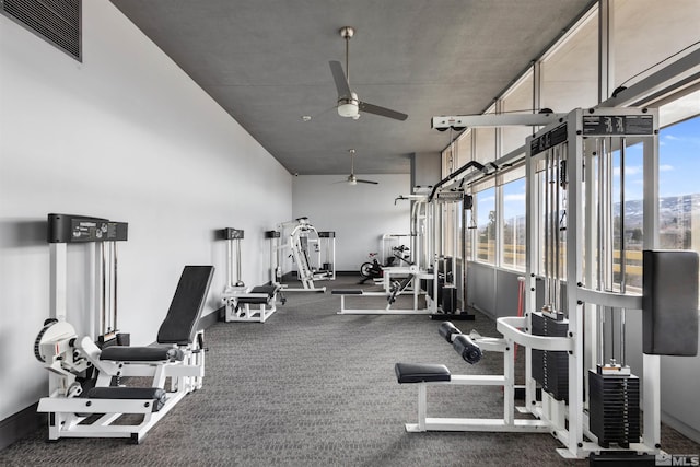 exercise room with ceiling fan