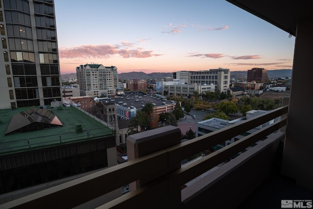 balcony at dusk with a mountain view