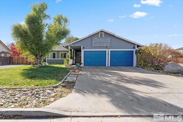 view of front of property with a front lawn and a garage