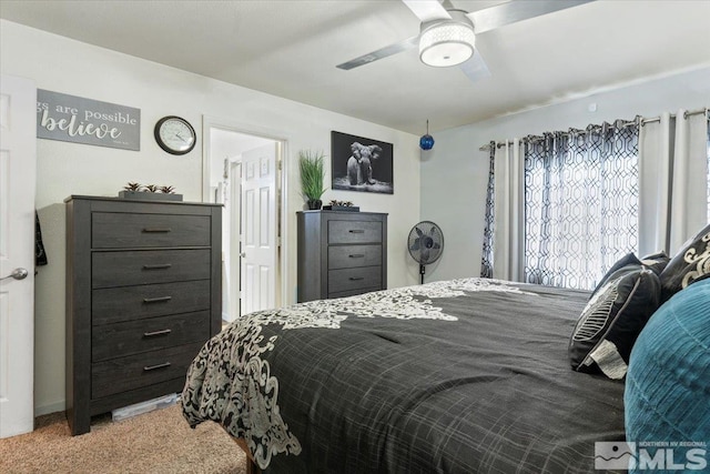 carpeted bedroom with ceiling fan