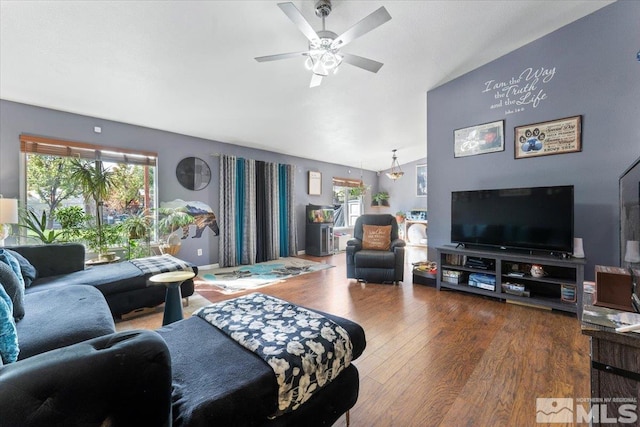 living room with lofted ceiling, hardwood / wood-style flooring, and ceiling fan