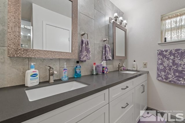 bathroom with vanity and decorative backsplash