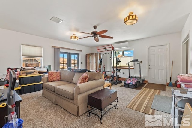 living room with french doors, light colored carpet, and ceiling fan